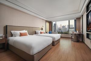 Mehood Lestie International Hotel Linhexi Guangzhou East Railway Station Branch - Free Shuttle Bus to Canton Fair Complex During Canton Fair Period & Free afternoon tea & Free midnight snack & Free VPN Internet Access客房内的一张或多张床位