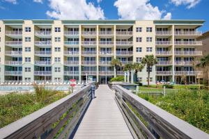 a boardwalk in front of a building at Waters Edge 507 in Fort Walton Beach