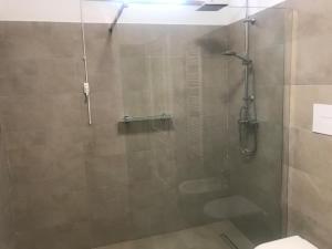 a bathroom with a shower and a toilet at Villa Montesegnale in Bolsena +41 photos