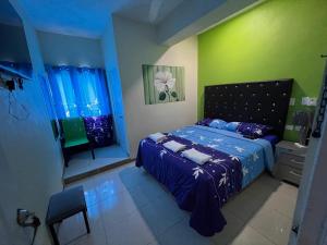 Postel nebo postele na pokoji v ubytování Hotel El Parque Constanza