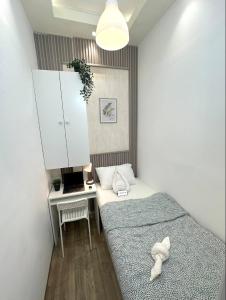 Postel nebo postele na pokoji v ubytování Cozy Partition Room for Travelers in Tecom