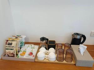a tray with cups and other items on a table at Nangyuan Island Dive Resort in Ko Tao
