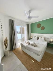 A bed or beds in a room at La Cabanana - Apartment w pool and high-speed WiFi