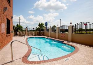 a swimming pool on a balcony of a building at ASPEN GRAND HOTEL LaPorte in La Porte