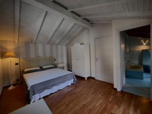 Postel nebo postele na pokoji v ubytování B&B Como Lake Cottage