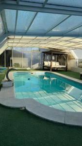 a large swimming pool in a house at Contemporary Villa in Atarfe with Private Pool and Mountain View in Atarfe