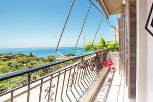 a balcony with a view of the ocean at Blue Maraçi 1 Beach Access nd Parking in Himare
