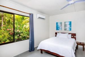 Postel nebo postele na pokoji v ubytování El Sueno Tropical