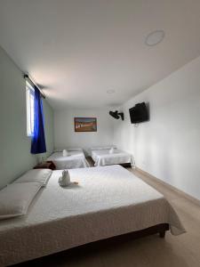 Postel nebo postele na pokoji v ubytování Hotel Estambul