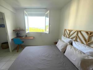 Posteľ alebo postele v izbe v ubytovaní Appartement avec vue sur mer