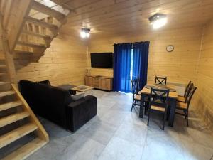 a living room with a couch and a table at Cicha Chata Szczyrk in Szczyrk