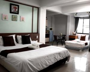 Ένα ή περισσότερα κρεβάτια σε δωμάτιο στο Aree Place Chiang Mai