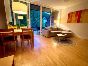 a living room with a table and a couch at Duplex Delight 18 Vila Mari in Pekre
