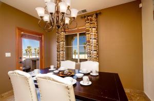 a dining room with a table and chairs and a chandelier at Condo76-4 The STAR OF THE SEA - EL DORADO RANCH SAN FELIPE BEACH RENTAL in La Ponderosa
