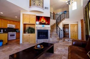 a living room with a fireplace and a staircase at Condo76-4 The STAR OF THE SEA - EL DORADO RANCH SAN FELIPE BEACH RENTAL in La Ponderosa