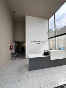 an office with a desk and a large window at View 15, San Francisco Tower in San Salvador +13 photos