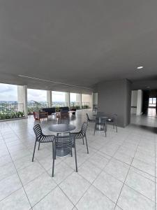 a room with tables and chairs in a building at View 15, San Francisco Tower in San Salvador