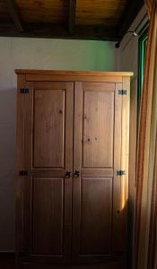 a wooden cabinet in the corner of a room at Club JM Lanzarote in Tabayesco