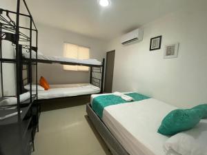 Postel nebo postele na pokoji v ubytování Shekinah House