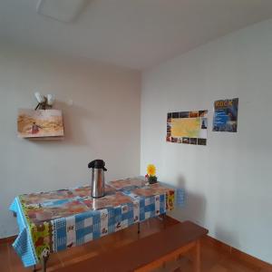 a table with a tea kettle on top of it in a room at AKAO HOUSE in Arequipa +31 photos