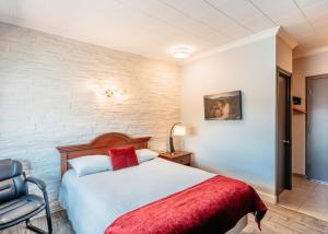 Postel nebo postele na pokoji v ubytování Hotel Motel Le Quiet