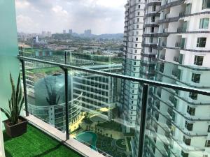 a view from the balcony of a apartment building at Cozy Family Condo in Petaling Jaya