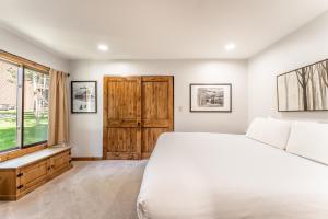 a bedroom with a large bed and a window at Wild Irishman #1030 by Summit County Mountain Retreats in Keystone +32 photos