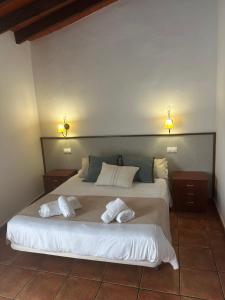 Postel nebo postele na pokoji v ubytování Hostal Camarina