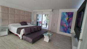Postel nebo postele na pokoji v ubytování Mirador samsara Suite Luxury piso completo