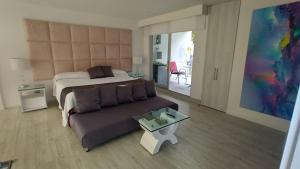 Postel nebo postele na pokoji v ubytování Mirador samsara Suite Luxury piso completo