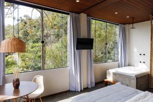 Ένα ή περισσότερα κρεβάτια σε δωμάτιο στο Vista do Vale lofts - Itaipava