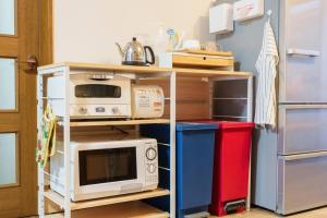 A cozinha ou cozinha compacta de 名古屋城に1番近い名古屋市北区若鶴民泊
