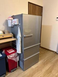 A cozinha ou cozinha compacta de 名古屋城に1番近い名古屋市北区若鶴民泊