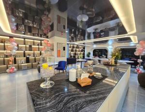 a store lobby with a table and chairs and balloons at Cybiq Ratchada 32 by Pikul in Bangkok