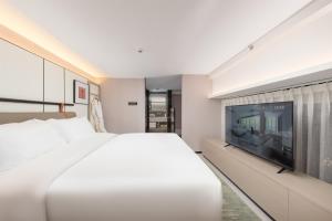 ONESS Executive Hotel Guangzhou Huangpu-Free Shuttle Bus from 15th October to 5th November客房内的一张或多张床位
