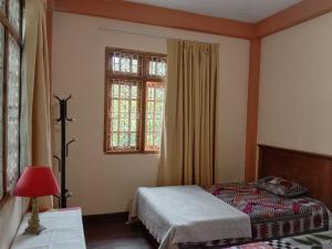 Postel nebo postele na pokoji v ubytování Shane HomeStay