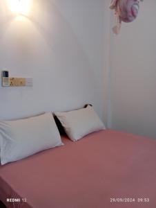 Postel nebo postele na pokoji v ubytování Pearl Deluna Resort Mirissa