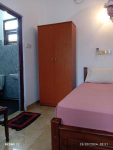 Postel nebo postele na pokoji v ubytování Pearl Deluna Resort Mirissa