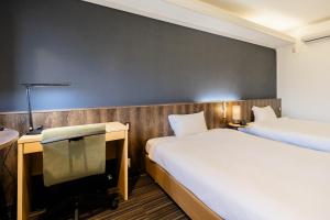 Postel nebo postele na pokoji v ubytování L stay & grow Harumi