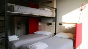 Letto o letti in una camera di Le Magnolie