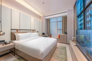 ONESS Executive Hotel Guangzhou Huangpu-Free Shuttle Bus from 15th October to 5th November客房内的一张或多张床位