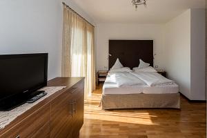 Postel nebo postele na pokoji v ubytování Garni Hotel Dorothea + 23 fotografií