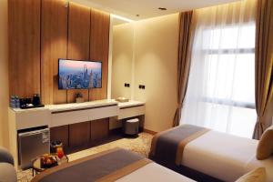 Voodi või voodid majutusasutuse Ramadi Hotel & فندق رمادي toas