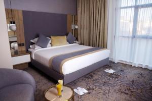 Voodi või voodid majutusasutuse Ramadi Hotel & فندق رمادي toas