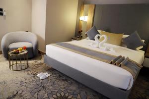 Voodi või voodid majutusasutuse Ramadi Hotel & فندق رمادي toas