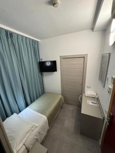 Postel nebo postele na pokoji v ubytování Hotel Parma
