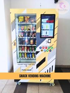 a snack vending machine is in a room at The Majestic Condo Ipoh Home Fairy 3 in Ipoh