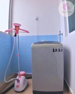 a room with a small refrigerator and a vacuum at The Majestic Condo Ipoh Home Fairy 3 in Ipoh