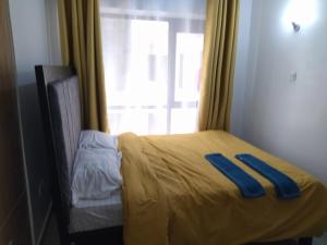 Postel nebo postele na pokoji v ubytování Tsavo Studio Fedha