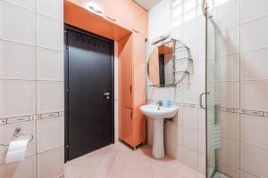 a bathroom with a black door and a sink at Old Town 2BR with Sea View in Durrës +12 photos